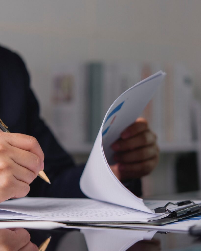 Reviewing contract documents at a desk